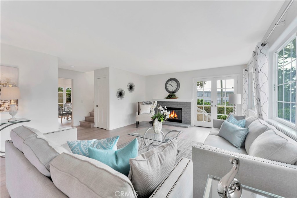 Spacious living room with cozy fireplace. New paint and laminate flooring throughout. - 27282 Via Bella, Dana Point CA 92624 - photo 1