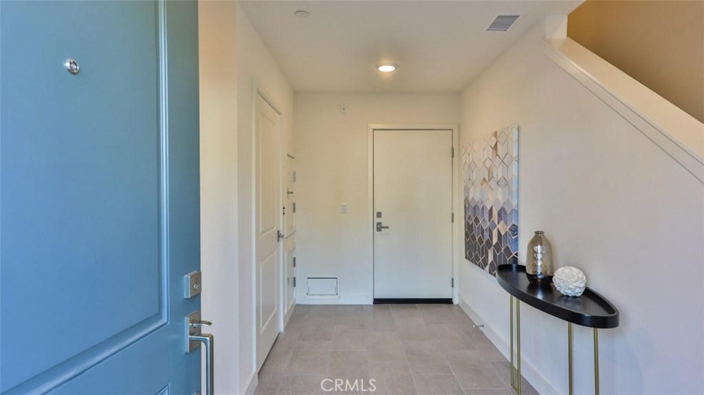 Welcome home. Entry foyer at front door / garage entrance / dumb waiter. - 2869 Doheny Way, Dana Point CA 92629 - photo 46