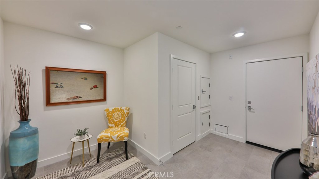 Welcome home. Entry foyer at front door / garage entrance / dumb waiter / renters closet. - 2869 Doheny Way, Dana Point CA 92629 - photo 47