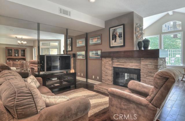 Gorgeous stacked stone fireplace with Mahogany Mantle. Custom tile floors that appear like wood. The other side of the f - 32 Bright Water Drive, Dana Point CA 92629 - photo 1