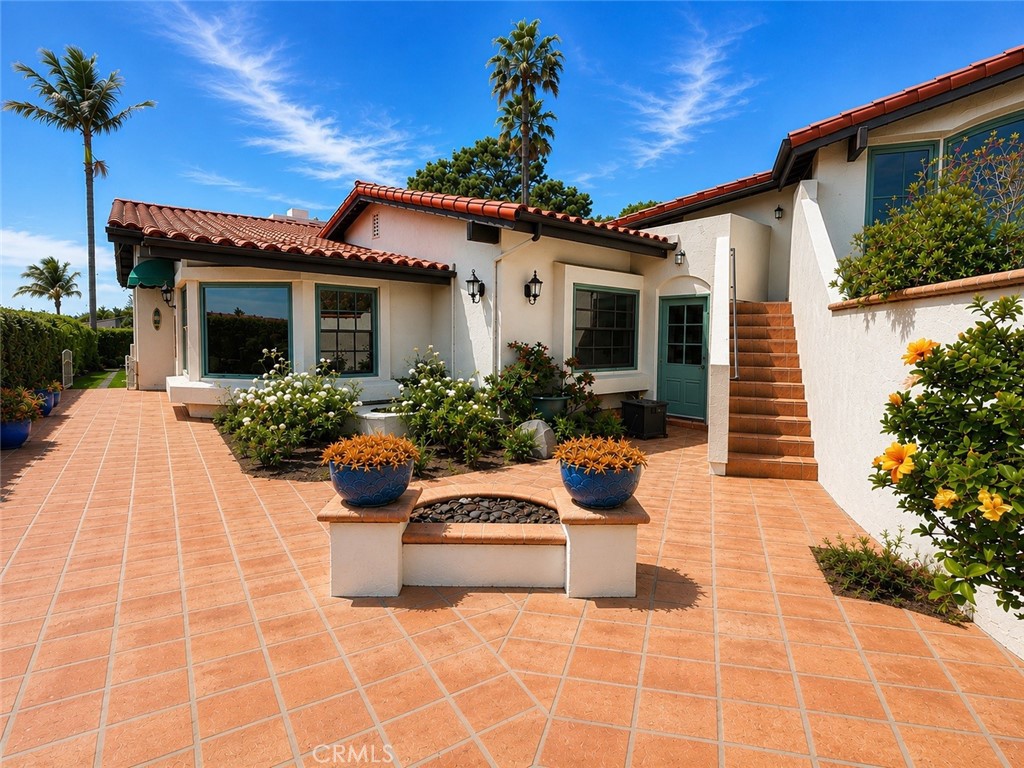 Your view as you walk to your front door. The upstairs multipurpose room has its own entrance and balcony. - 32355 Via Antibes, Dana Point CA 92629 - photo 2