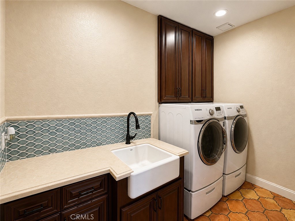 Inside, laundry room with washer, dryer, and plenty of storage - 32355 Via Antibes, Dana Point CA 92629 - photo 25