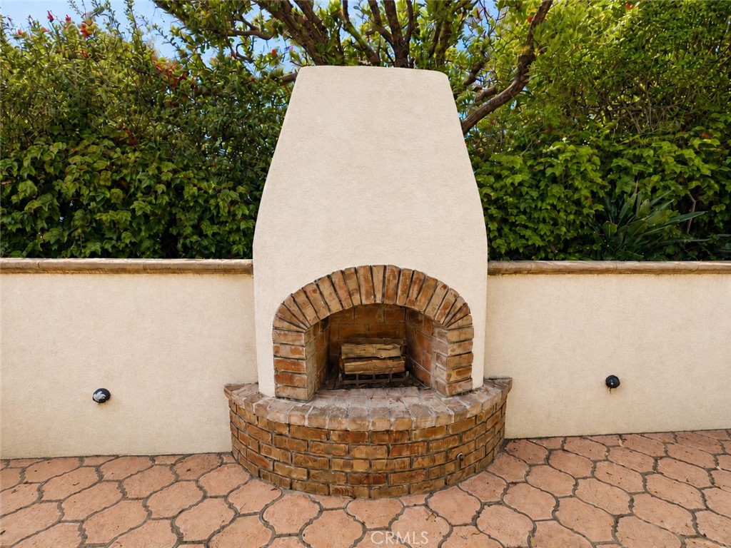The outdoor fireplace - 32355 Via Antibes, Dana Point CA 92629 - photo 29
