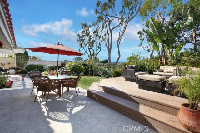 Entertainer's backyard featuring spacious ocean view deck, waterfall landscaping and built-in BBQ. - 32421 Via Antibes, Dana Point CA 92629 - photo 1