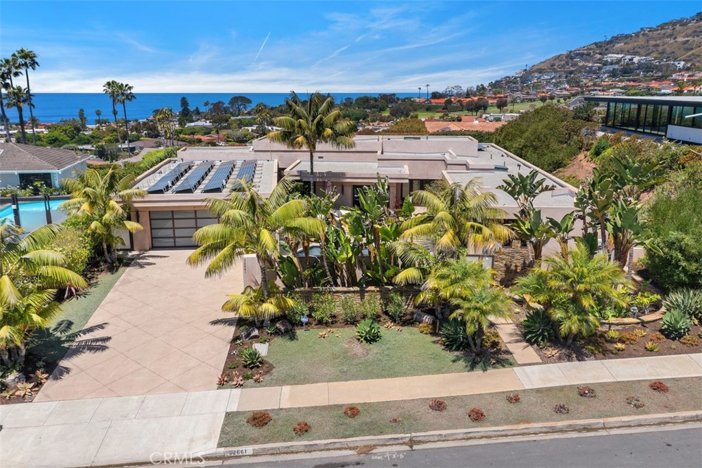 Just a short walk to pristine Beaches, from this beautifully landscaped home with gorgeous ocean views with pool, spa an - 32661 Caribbean Drive, Dana Point CA 92629 - photo 1