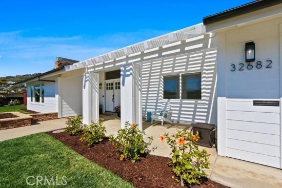 Newly remodeled front elevation of the beach close charming single level. - 32682 Seven Seas Drive, Dana Point CA 92629 - photo 1