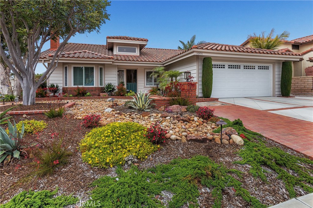 Rolling front Yard with Low Maintenance Drought tolerant landscape and dry riverbed. Rich Brick accents make for an invi - 32831 Samuel Circle, Dana Point CA 92629 - photo 1
