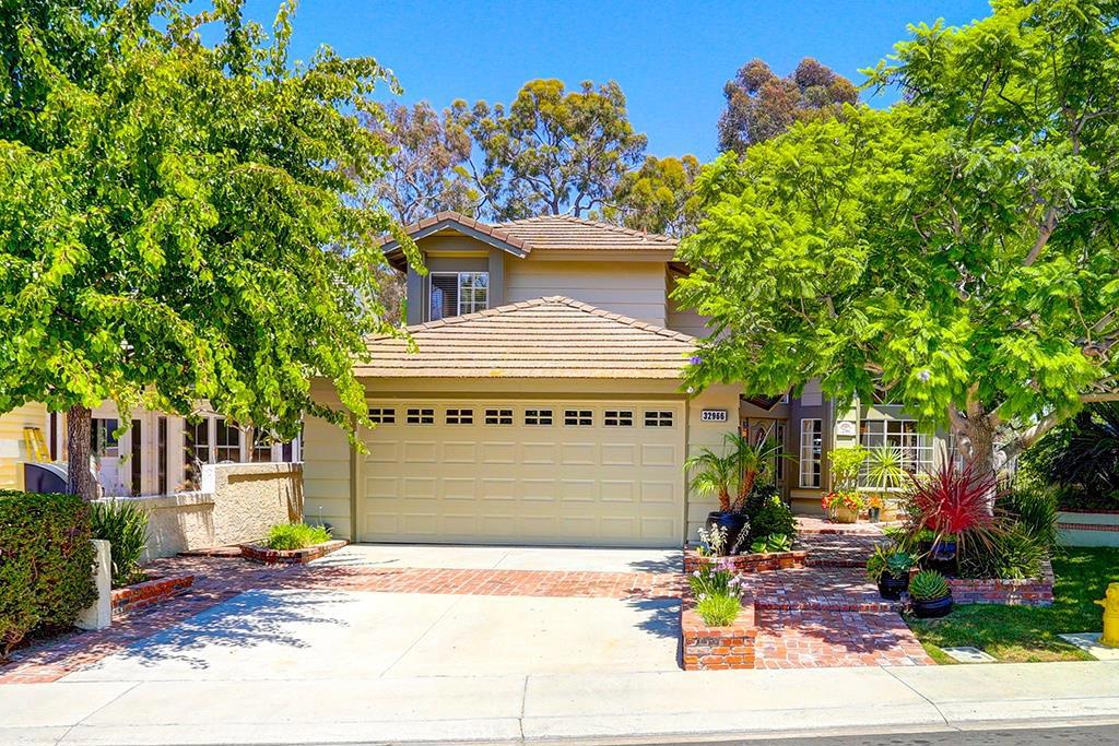 Welcome home! Gorgeous curb appeal enhanced by mature trees and brick hardsape! - 32966 Danapalm, Dana Point CA 92629 - photo 1