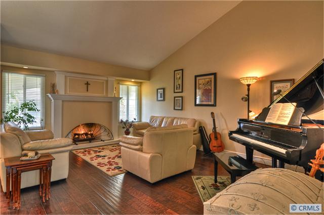Beautiful hardwood floors, Vaulted ceilings & a lovely fireplace greet you as you enter the home. - 33072 SEA BRIGHT Drive, Dana Point CA 92629 - photo 1