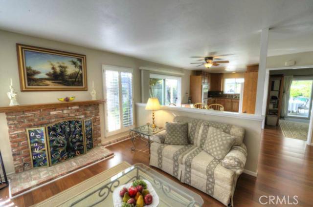 The light and open living room has wonderful jalousie windows for cooling breezes, has wonderful natural light and is a - 33141 Big Sur Street, Dana Point CA 92629 - photo 1