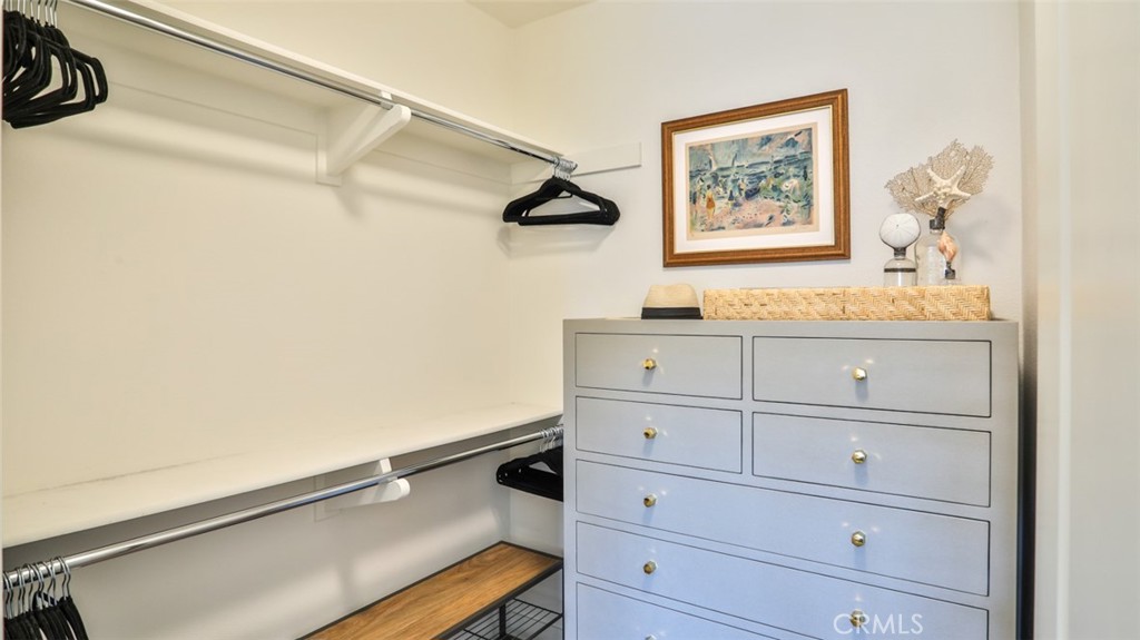 Walk-in closet at primary suite - 3319 Doheny Way, Dana Point CA 92629 - photo 33