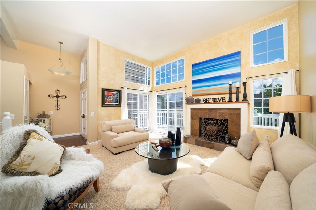 living room with fireplace for your cozy evenings at home. - 33221 Ocean Ridge 38, Dana Point CA 92629 - photo 1
