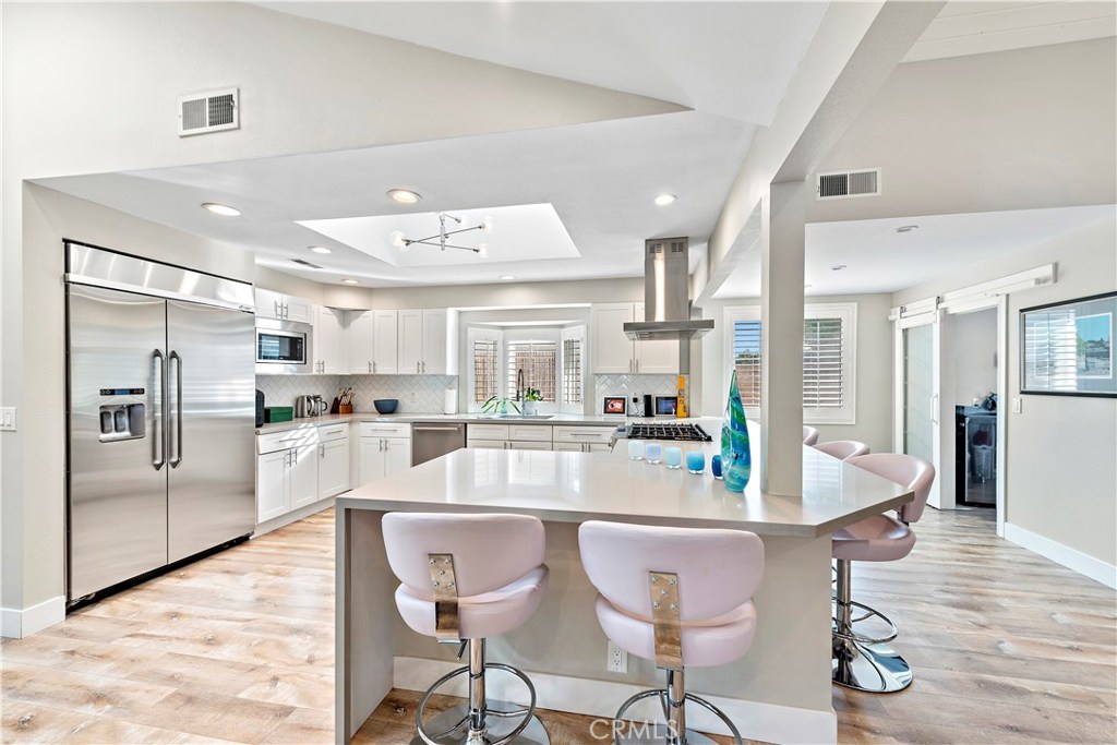 Updated kitchen with built in refrigerator, all stainless steel appliances, white shaker cabinets, quartz counter tops, - 33231 Big Sur Street, Dana Point CA 92629 - photo 1