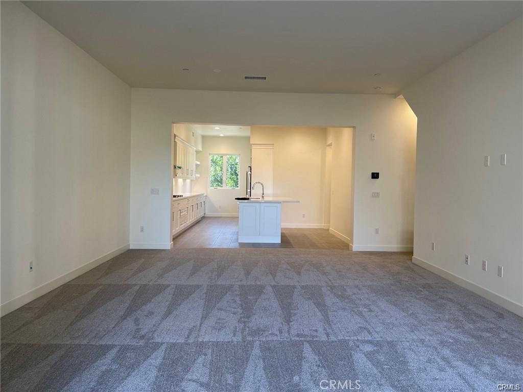 Spacious living room off of the kitchen. - 3326 Doheny Way, Dana Point CA 92629 - photo 9