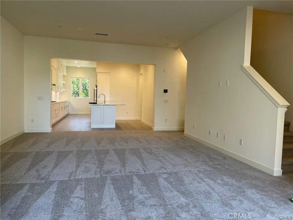 Spacious living room off of the kitchen. - 3326 Doheny Way, Dana Point CA 92629 - photo 10