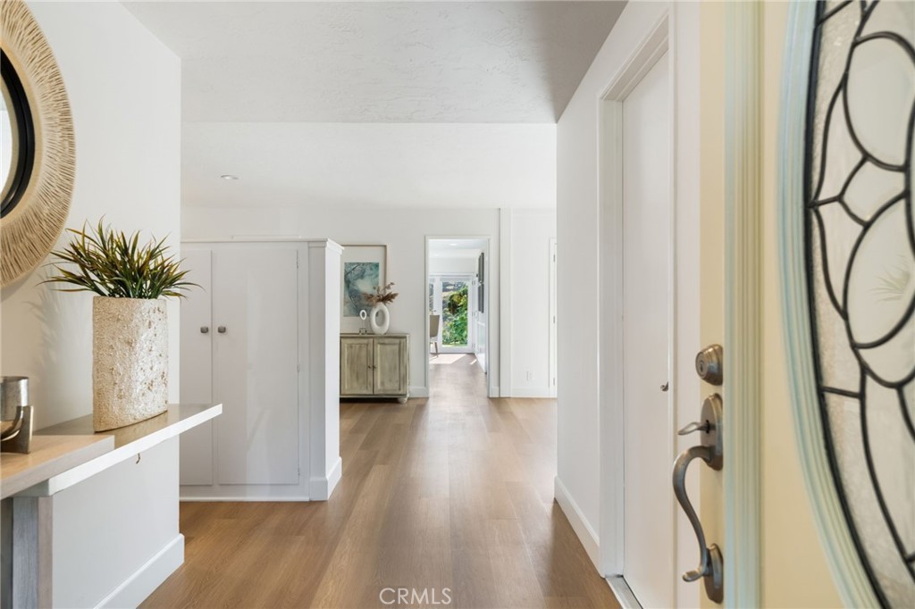 The airy and open feel begins upon entry. On the right is direct access to the garage. - 33261 Ocean Hill, Dana Point CA 92629 - photo 6