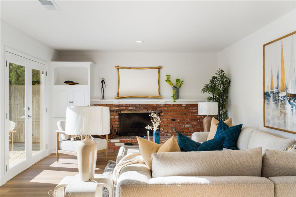 The beautiful brick fire place is the evening focal point for warmth and entertainment. - 33261 Ocean Hill, Dana Point CA 92629 - photo 8