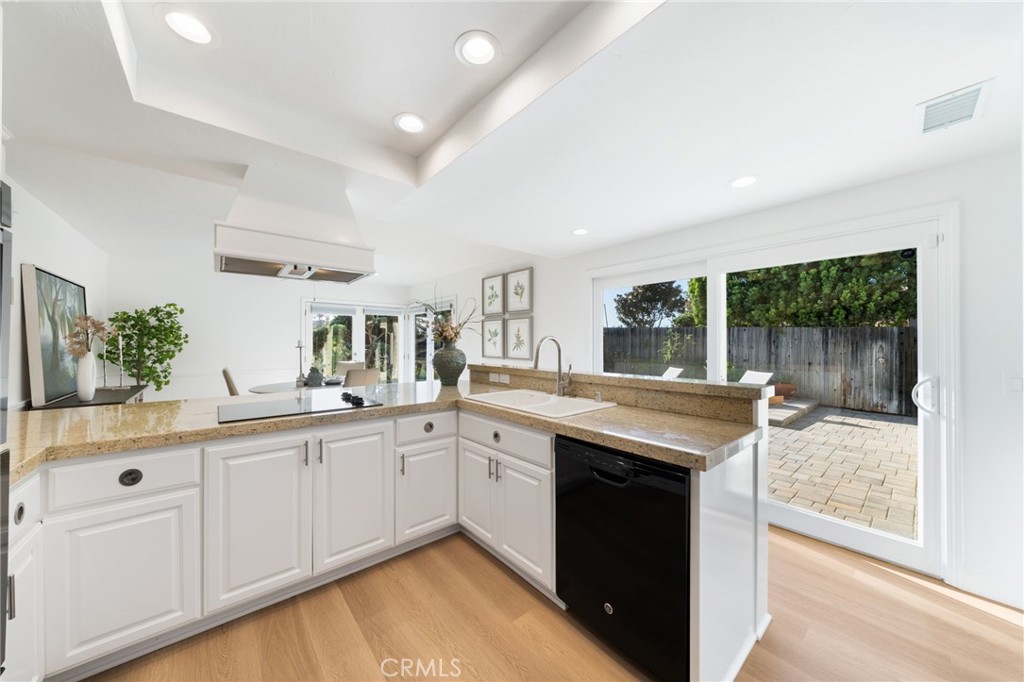A great size working kitchen with breakfast bar and great views of Patio and the family area. - 33261 Ocean Hill, Dana Point CA 92629 - photo 17