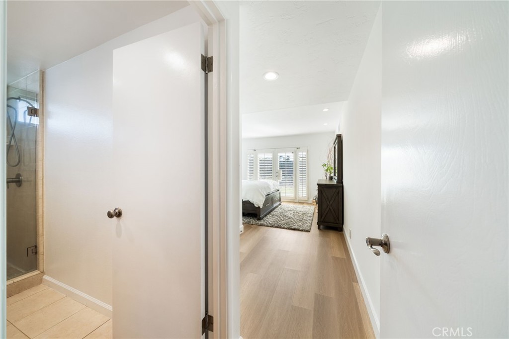 Starting at the back of the home, the private Primary ensuite Bedroom has a large walk-in shower and large walk-in close - 33261 Ocean Hill, Dana Point CA 92629 - photo 25