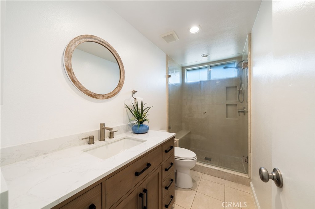Primary Bath with windows in shower that open. Large counter area in addition to the sink makes it very functional. - 33261 Ocean Hill, Dana Point CA 92629 - photo 29