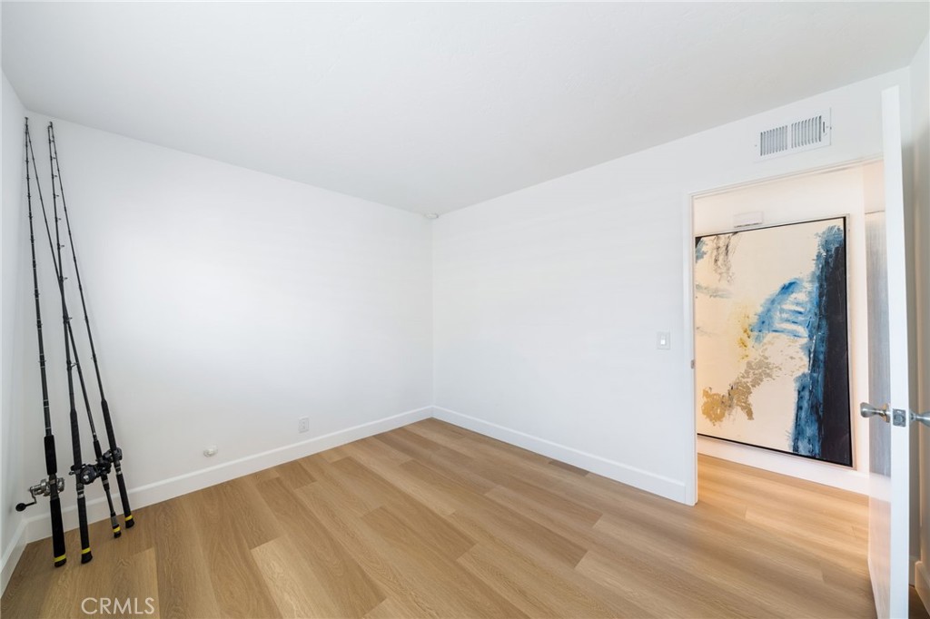 Bedroom number 3 is VERY LARGE. The fishing polls standing at left actually are shorter than the wall from door to corne - 33261 Ocean Hill, Dana Point CA 92629 - photo 30