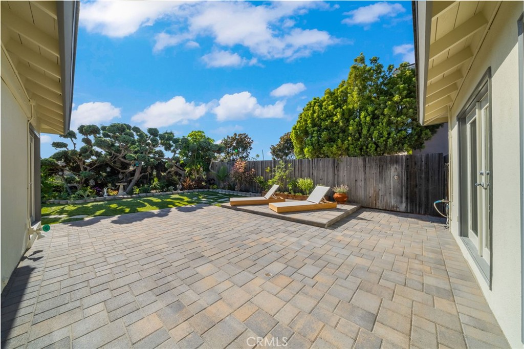 Newly laid pavers create a beautiful backyard space. Slightly raised deck is perfect place to relax. Small raised garden - 33261 Ocean Hill, Dana Point CA 92629 - photo 39