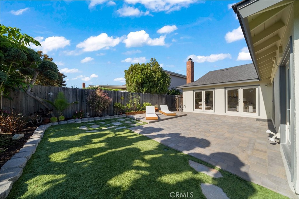 Looking back across the patio to the Living room. It is a very large yard! - 33261 Ocean Hill, Dana Point CA 92629 - photo 40