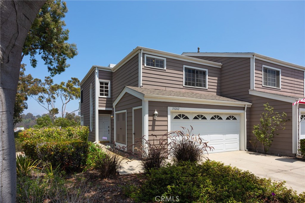 Beautiful end-unit townhome with attached 2-car garage and driveway. - 33262 Ocean Bright 20, Dana Point CA 92629 - photo 1