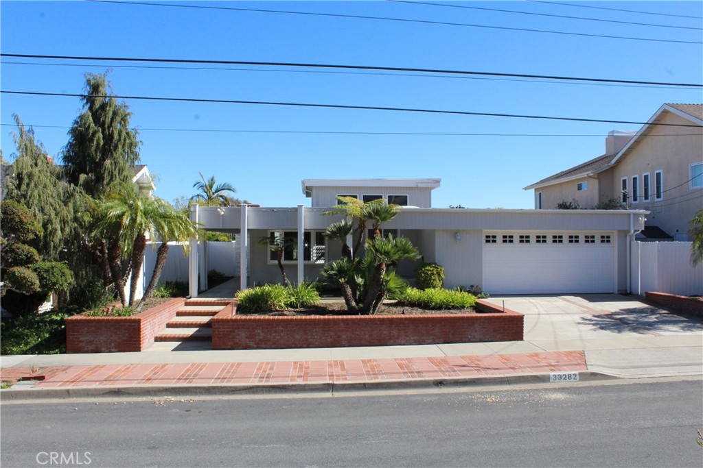 Located on a Single Loaded Street for privacy and plenty of Parking. Beautifully Hardscaped Low maintenance Front Yard o - 33282 Astoria Street, Dana Point CA 92629 - photo 1