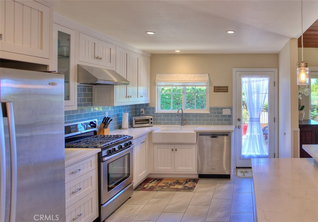 Brand new dream kitchen with inset soft close cupboards doors and drawers. Quartz countertops and stainless appliances. - 33322 Bremerton Street, Dana Point CA 92629 - photo 1