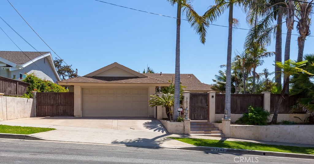 Beach Home in Paradise!! Single Story with Ocean View. The gates on left side of driveway open at the center to a space - 33342 Astoria Street, Dana Point CA 92629 - photo 1