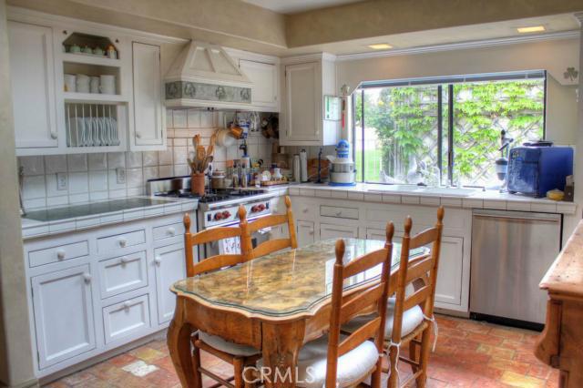 Sunny kitchen. SmallBone design. Antique French pavers underfoot. Wolff range, Bosh Dishwasher, Jennaire unit. - 33521 Atlantic Avenue, Dana Point CA 92629 - photo 1