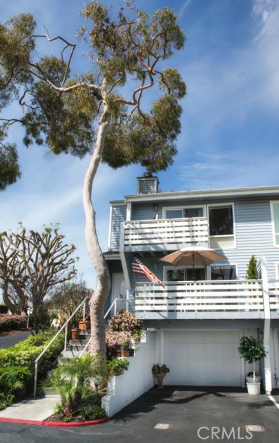 End unit with oversized garage and parking space in front of garage. Dual decks off living room and master. The living r - 33591 Dana Vista Drive A, Dana Point CA 92629 - photo 1