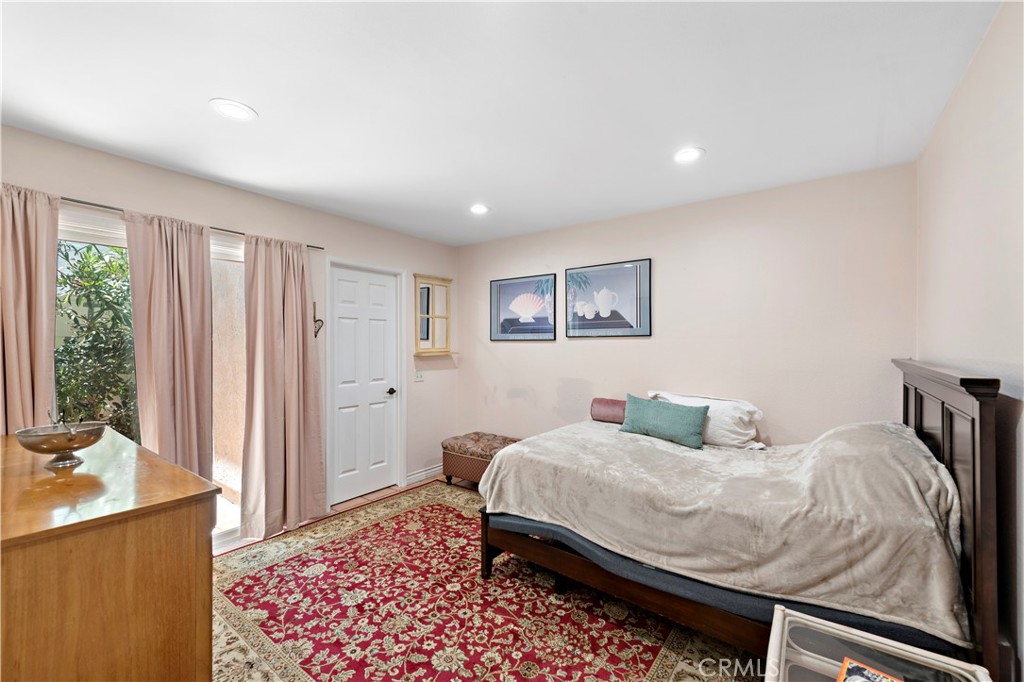 Downstairs Bedroom features Walk-in Closet, Slider to Side Yard and Adjacent Full Bathroom! Perfect for Guests or In-Law - 33622 Via Martos, Dana Point CA 92629 - photo 35