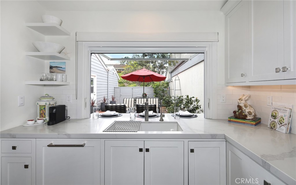 KITCHEN WINDOW OPENS TO COURTYARD - 33721 Flying Jib Drive, Dana Point CA 92629 - photo 15