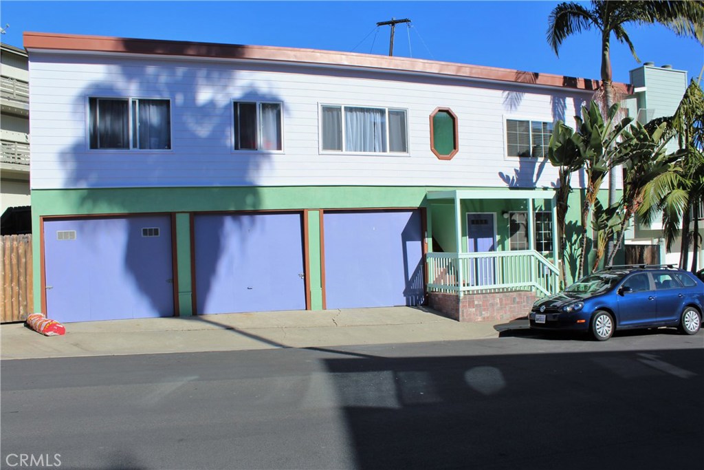 The Triplex with a personality. This unit has its own entrance with screen door. Detached 1 car garage (on the far left) - 33756 Robles Drive, Dana Point CA 92629 - photo 1