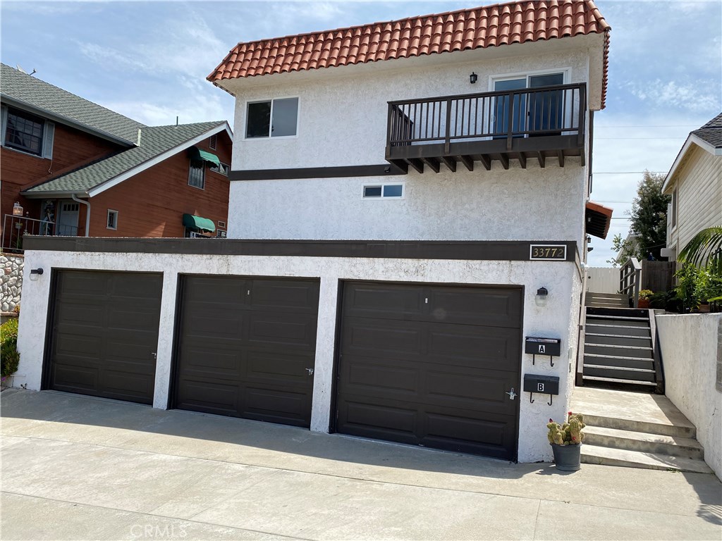Townhouse style unit. No one above or below. 2 Car garage, Entrance to unit on side of building. Balcony is off of Livin - 33772 Diana Drive A, Dana Point CA 92629 - photo 1
