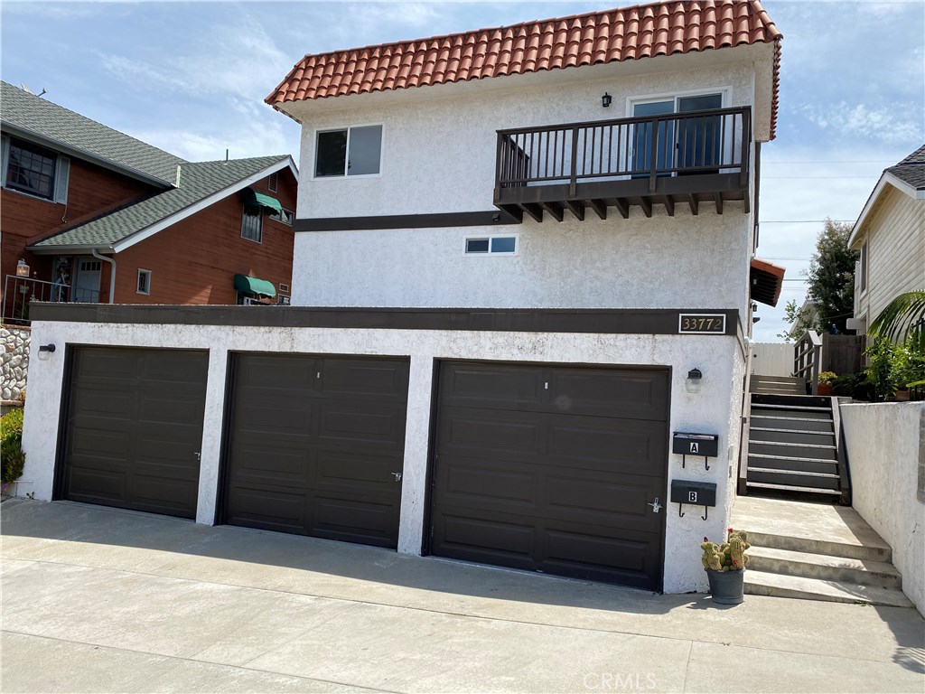 Townhouse style unit. No one above or below. 2 Car garage, Entrance to unit on side of building. Balcony is off of Livin - 33772 Diana Drive A, Dana Point CA 92629 - photo 1