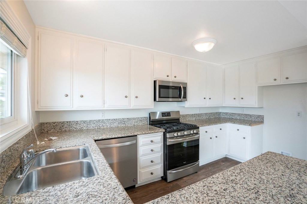 Light and bright updated kitchen w/ new SS appliances - 33794 Copper Lantern Street, Dana Point CA 92629 - photo 1