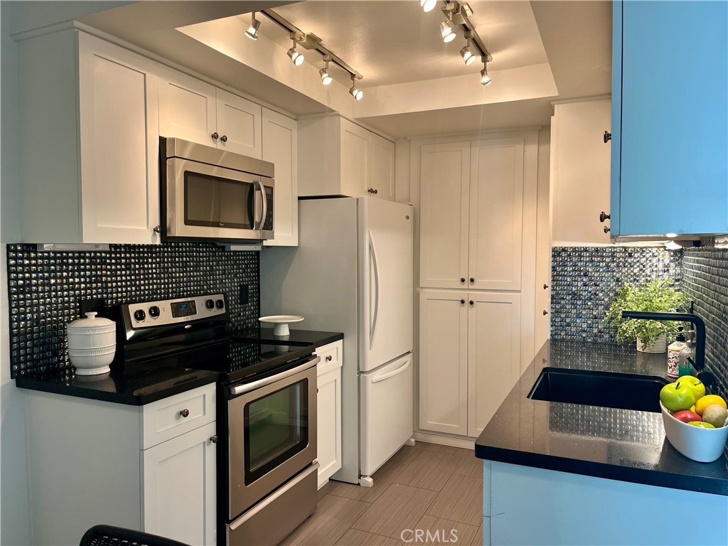 Modern kitchen with newer appliances - 33852 Del Obispo 27, Dana Point CA 92629 - photo 1