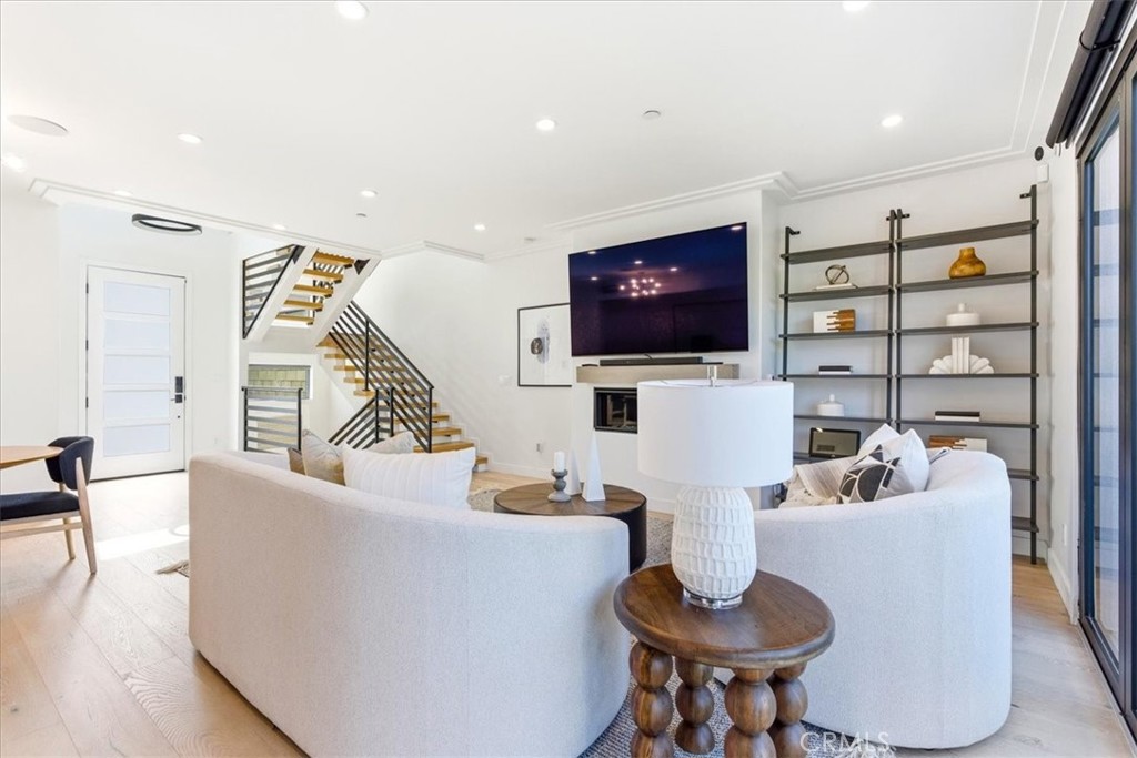 Alternate view of the living room showcasing the open-concept layout and stylish finishes. - 33871 Calle La Primavera, Dana Point CA 92629 - photo 5
