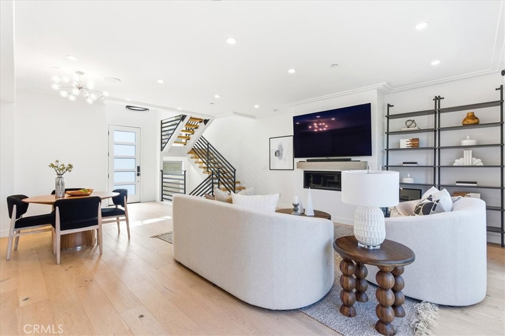 Great room perspective highlighting the cohesive design and spacious open-concept floor plan. - 33871 Calle La Primavera, Dana Point CA 92629 - photo 11