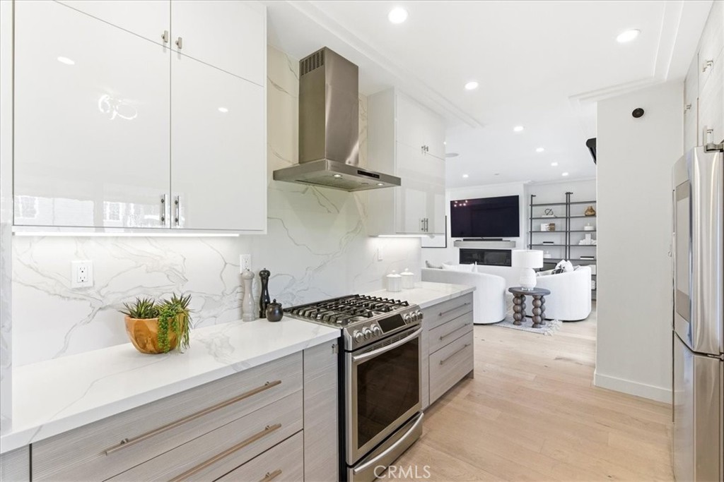 Well-appointed kitchen with expansive countertops, modern finishes, and excellent storage solutions. - 33871 Calle La Primavera, Dana Point CA 92629 - photo 16