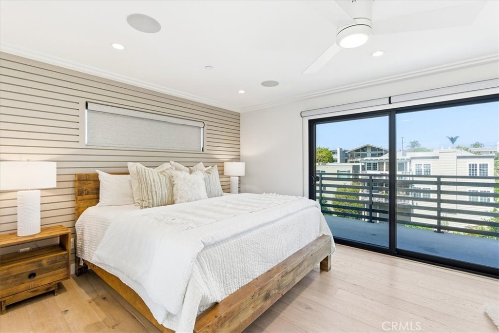 Spacious primary bedroom offering abundant natural light and direct access to a private balcony. - 33871 Calle La Primavera, Dana Point CA 92629 - photo 18