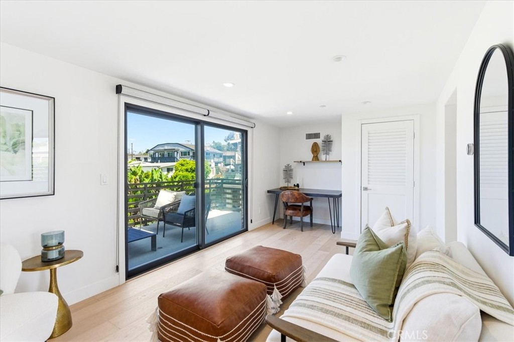 Comfortable bedroom retreat featuring large windows, inviting natural light, and a relaxing ambiance. - 33871 Calle La Primavera, Dana Point CA 92629 - photo 20
