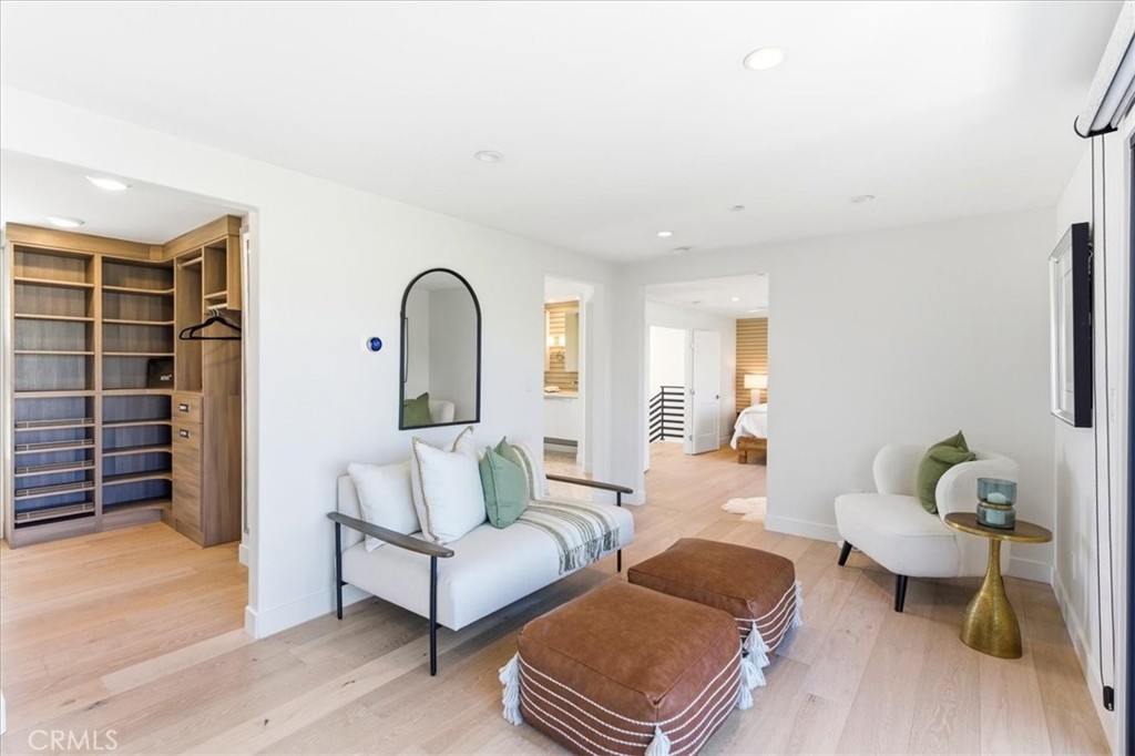 Elegant sitting area creating a welcoming transition between the bedroom and dressing spaces. - 33871 Calle La Primavera, Dana Point CA 92629 - photo 21