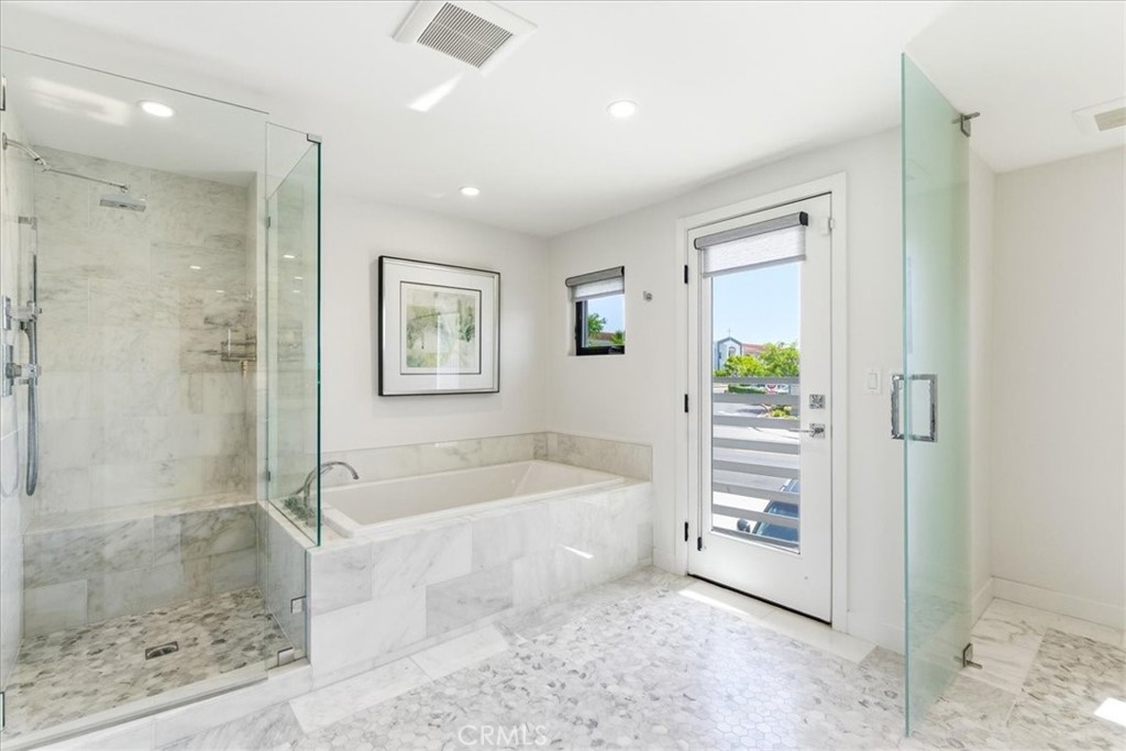 Alternate view of the primary bath showcasing the spacious walk-in shower and spa-inspired design. - 33871 Calle La Primavera, Dana Point CA 92629 - photo 24