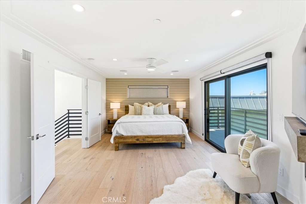 Spacious secondary bedroom featuring abundant natural light, contemporary finishes, and access to a private balcony. - 33871 Calle La Primavera, Dana Point CA 92629 - photo 27
