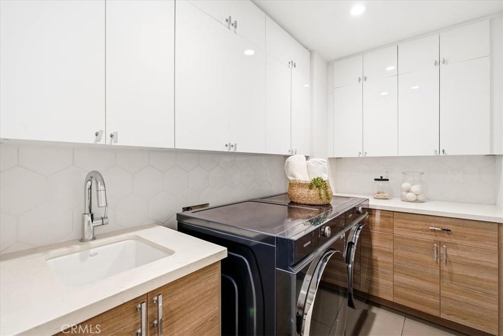 Well-appointed kitchenette with custom cabinetry, ample counter space, and modern functionality. - 33871 Calle La Primavera, Dana Point CA 92629 - photo 28