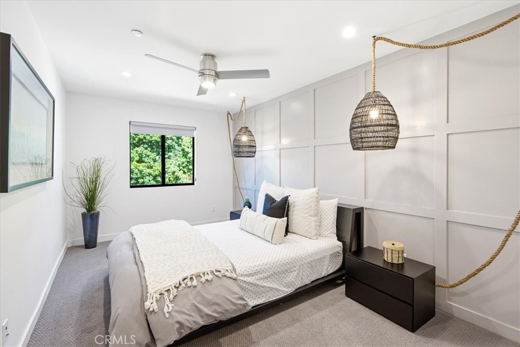 Comfortable guest bedroom offering natural light, designer finishes, and a relaxing atmosphere. - 33871 Calle La Primavera, Dana Point CA 92629 - photo 30